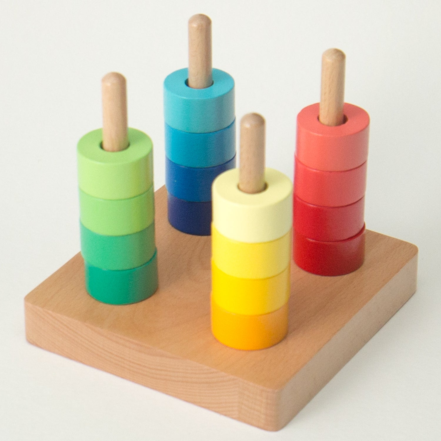 Montessori toys in New Zealand: Rainbow Discs on Four Dowels